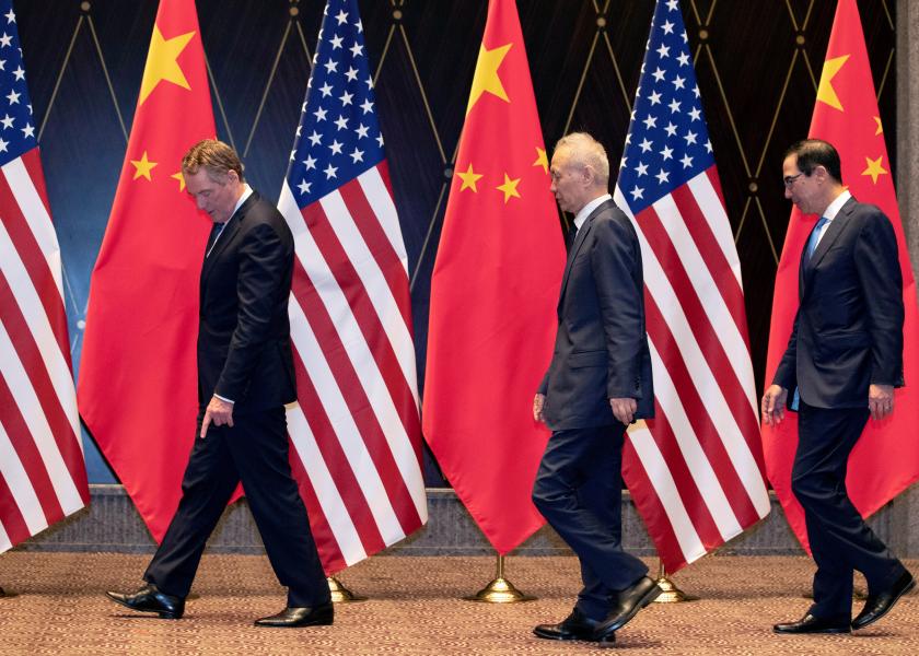 FILE PHOTO: U.S. Trade Representative Robert Lighthizer points at markers on the floor as he leads Chinese Vice Premier Liu He and Treasury Secretary Steven Mnuchin to their position for a family photo at the Xijiao Conference Center in Shanghai, China, July 31, 2019. Ng Han Guan/Pool via REUTERS/File Photo